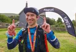 Tim Pigott next to the finish line