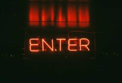 A neon sign showing the word 'ENTER'