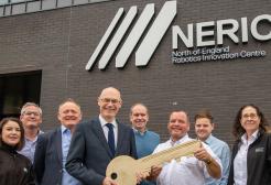 Karl Dayson with staff colleagues outside the North of England Robotics Innovation Centre (NERIC), University of Salford
