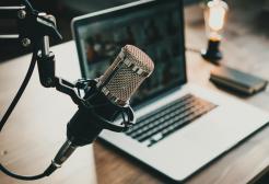 Microphone and laptop on a desk 