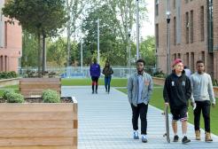 Students leaving Peel Park Quarter accommodation