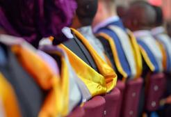 Row of seated graduates at a graduation ceremony