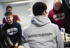 Student wearing a physiotherapy hoodie 