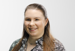 A woman with long hair smiling 