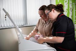 Two nursing apprentices looking at drugs