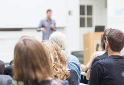 A man teaching in class 