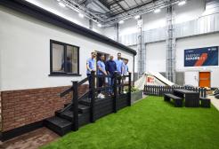 Five people stood outside a Vector Home inside Energy House 2.0