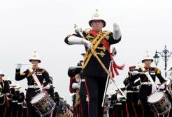 Band of marines playing instruments in the street