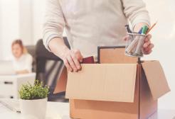 a man packing in a box