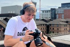 A guy holding a camera