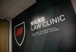 SILKS Law display against a wall