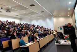Mr Justice Fordham addresses a full lecture hall