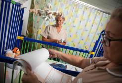 Two nurses looking at files in a children's hospital ward