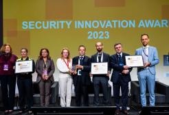 A line of people accept the 2023 Security Innovation Award 