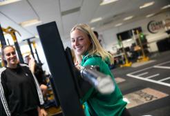 Picture shows young woman in gym 