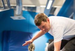 Trainer providing guidance on stretching