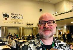 Dr Stephen M Hornby portrait, holding a medal