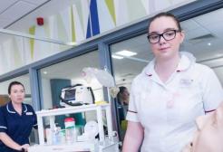 Student nurse using simulation suites that replicate a real hospital ward environment 