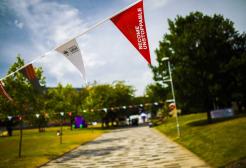 Open day bunting hanging in Peel Park, University of Salford