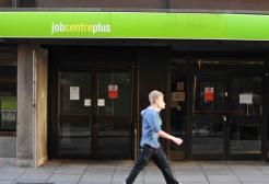 Man walking past a Job Centre 