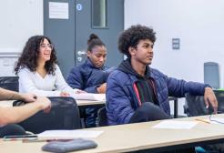 Four students in a seminar sat at desks