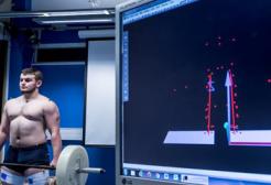 Person deadlifting weights whilst conduction a test