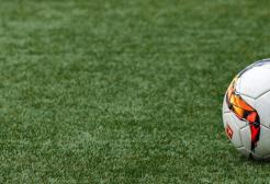 A football on artificial turf