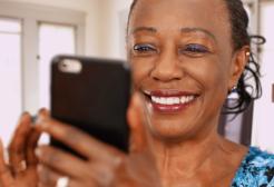 Lady looking at Bumble app on phone 