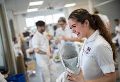 Prosthetics and Orthotics student holding a leg cast