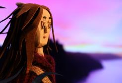 An animation women looks out to sea in front of a purple hued background