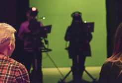 Students using green screen and camera facilities