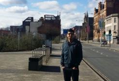A male student stood on Chapel Street looking into the camera
