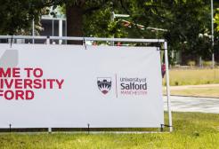 Welcome to the University of Salford signage on campus