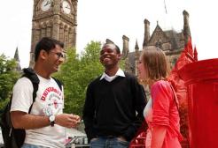 Three students meet outside Manchester Town Hall