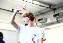 Louis Harris pulls a dancing pose in a dance studio