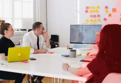 Colleagues attend a meeting