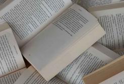 Books opened revealing pages of text