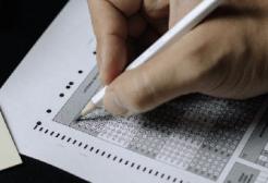 A person marks a test