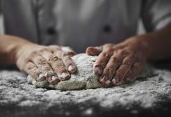 Hands kneading dough