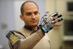 Man demonstrating a robotic arm
