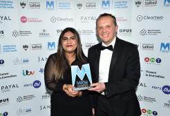 Saywah Mahmood holds the Asian Media Awards trophy with Paul Broster