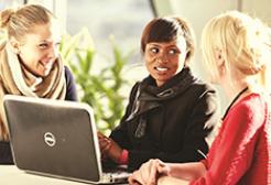 Three colleagues in conversation