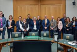 Yeliz Prior and colleagues at a Parliament meeting