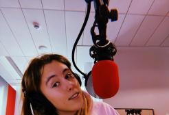 A selfie photo of Issy Brand in the MediaCity campus radio studio