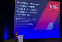 Piyawan speaking at conference