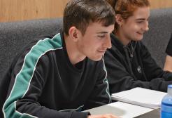 A student studying during lecture
