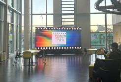 MediaCity Campus lobby area featuring a large screen advertising the "Festival of Short Film"