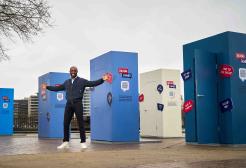 Celebrity Tim Campbell launches the Talking Futures Campaign standing in front of models of giant doorways