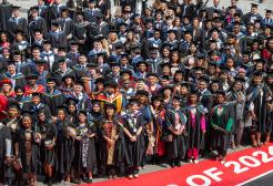 Graduates posing for a group photo after their graduation ceremony