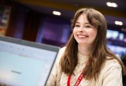 A student at the askUS counter in University House, University of Salford